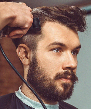 Collage of 2024's top 5 men's haircuts: textured crop, modern pompadour, skin fade, buzz cut, and slicked-back styles