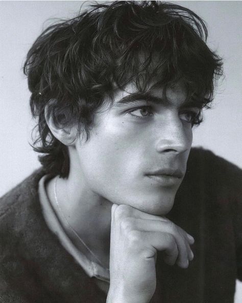 Side-by-side comparison of 2024 trending men's haircuts on different hair types showing textured crops and modern fades