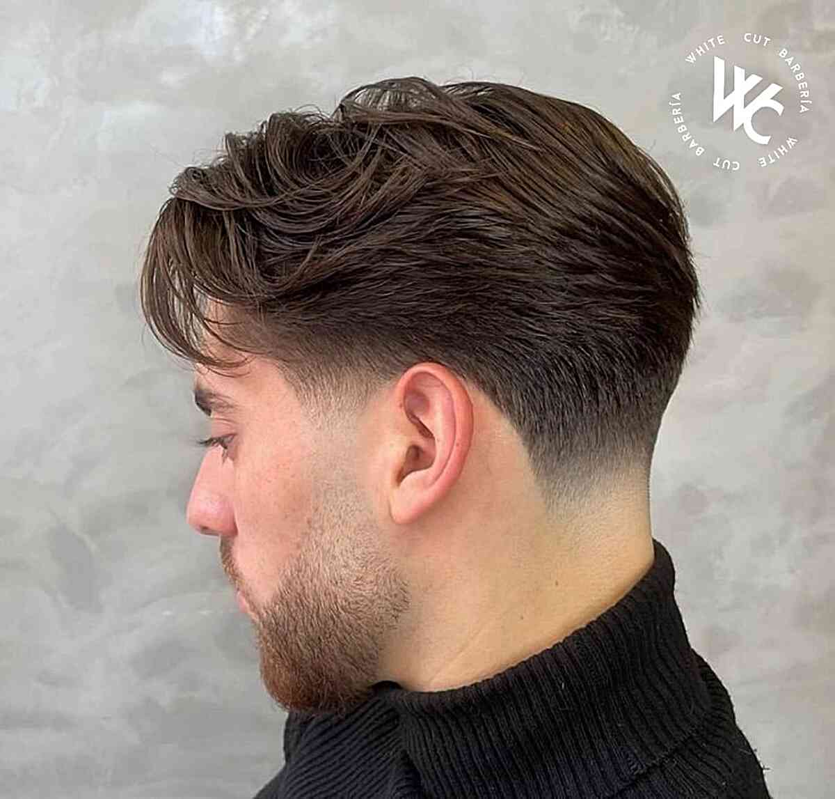 Close-up of textured taper fade with soft waves