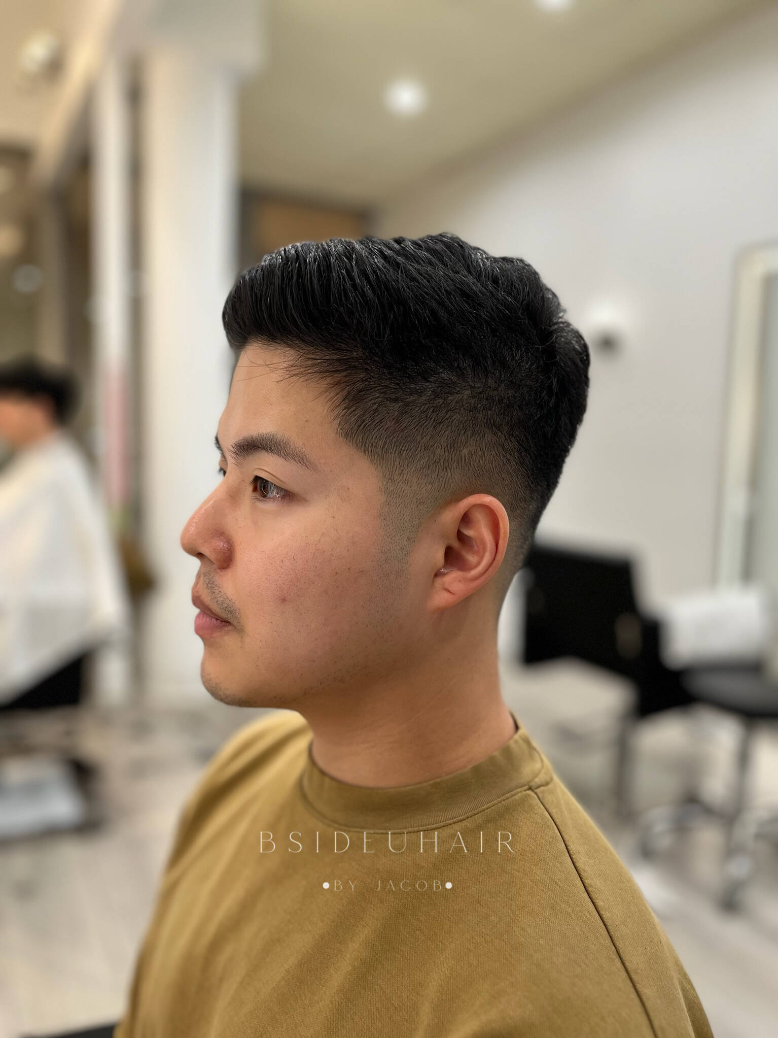 Side profile of a low-maintenance modern fade haircut