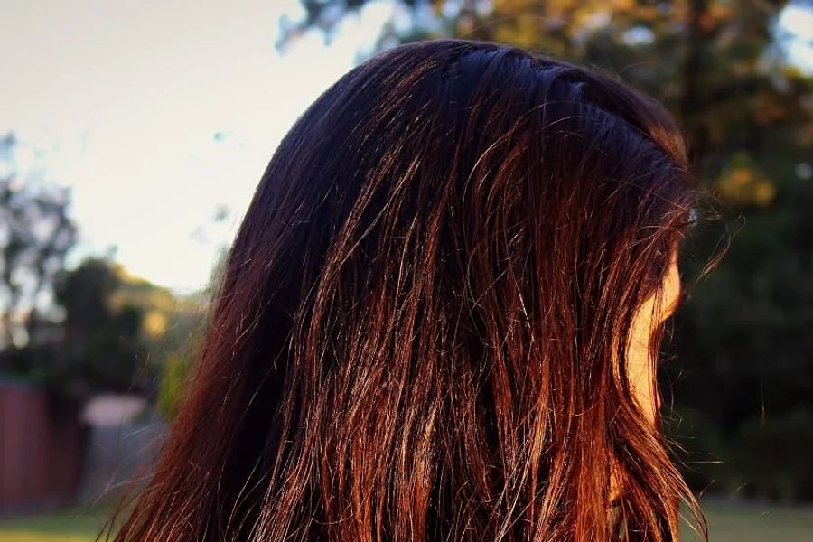 applying hair lightener for highlights