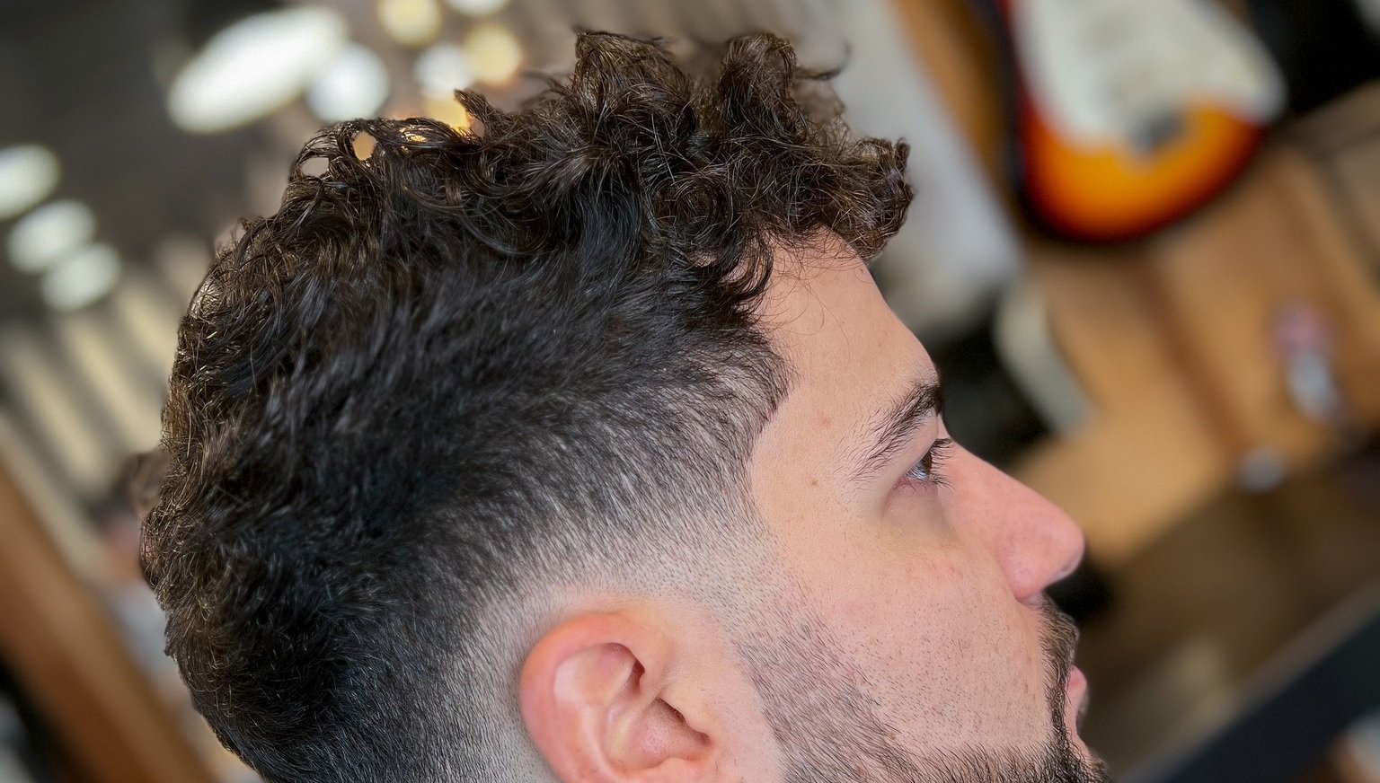 curly top fade with highlights for men