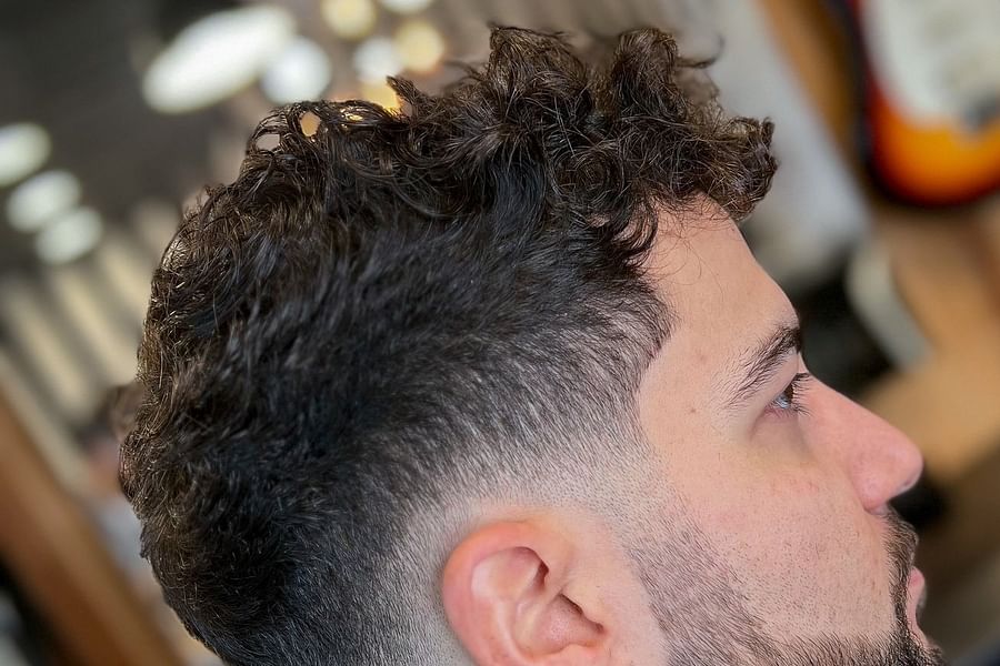 curly top fade with highlights for men