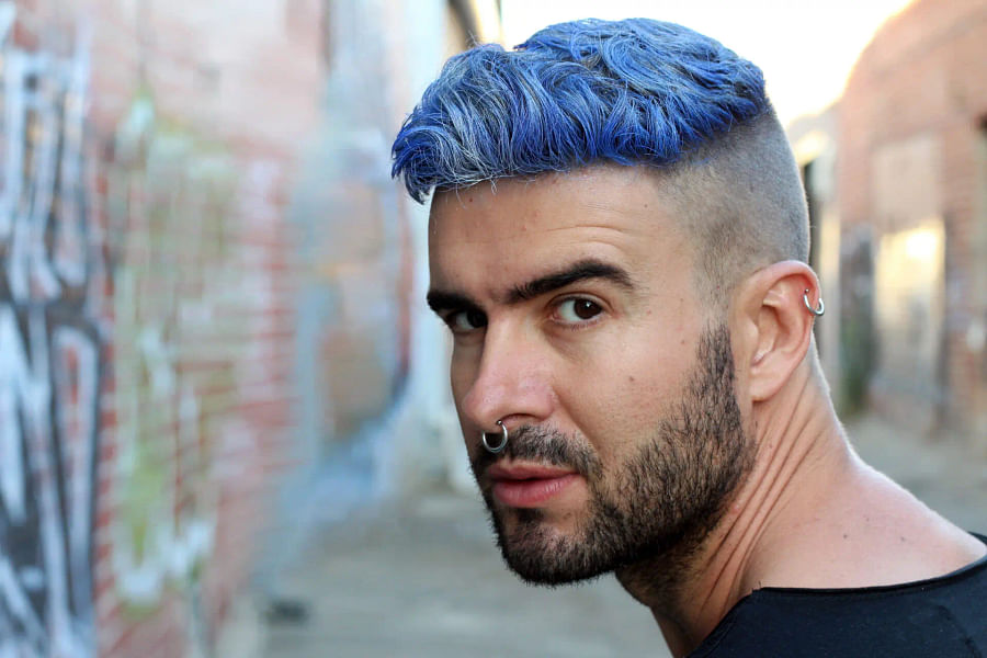 Stylish man with a trendy colored haircut