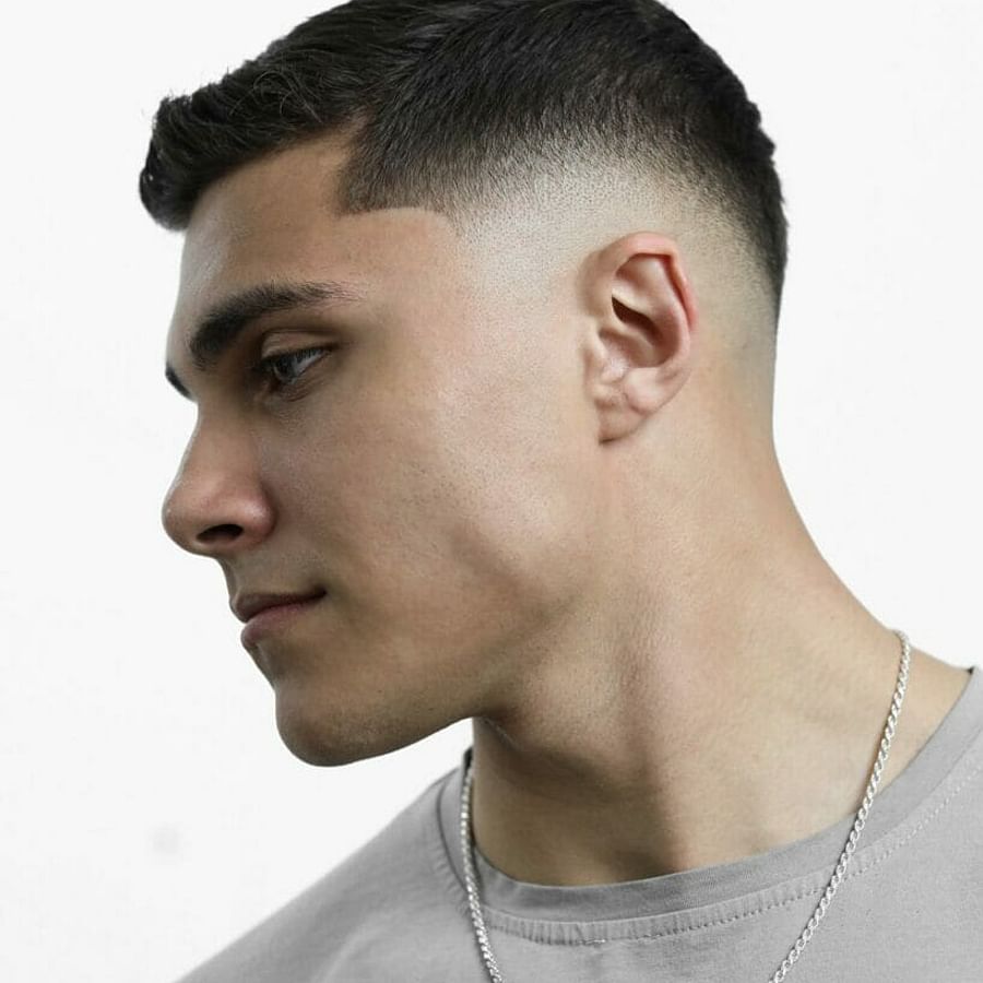 Variety of men\'s mid fade haircuts on different hair types and face shapes